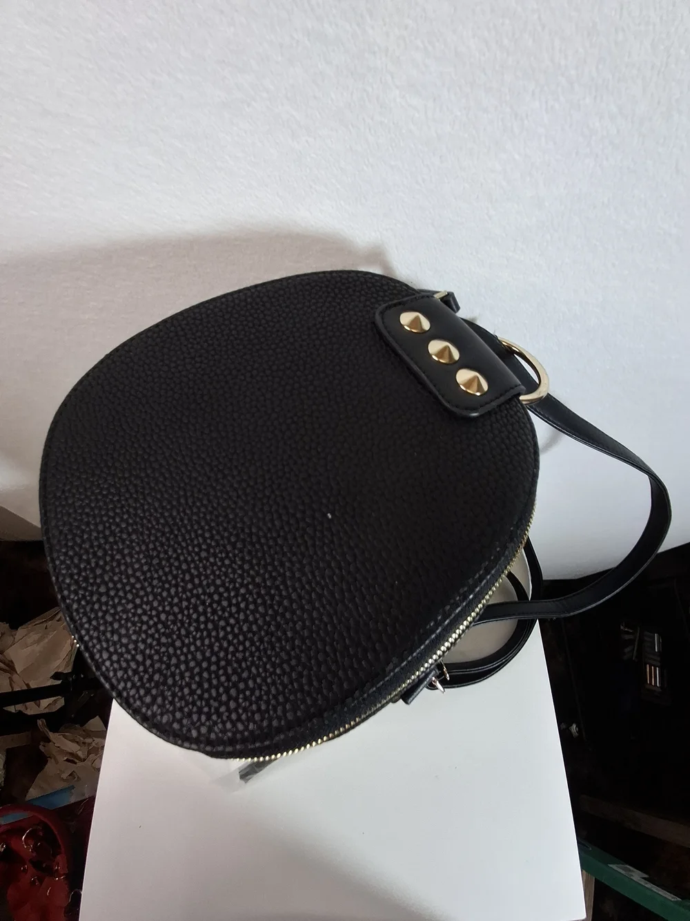SWG Black Pebbled Sling Barrel Backpack with Gold Accents
